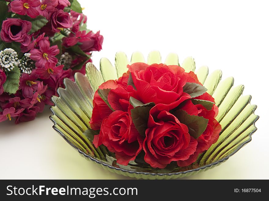 Bunch of roses in green glass bowl