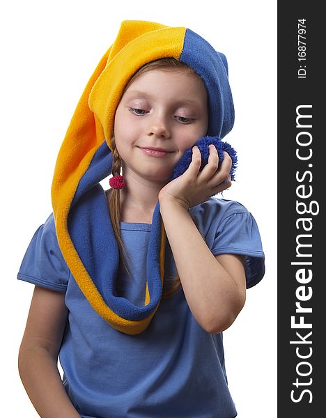 Little girl in the yellow-blue gnome cap isolated over white background. Little girl in the yellow-blue gnome cap isolated over white background