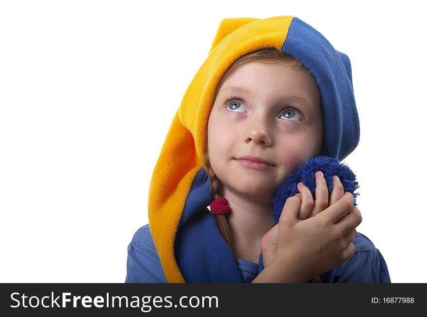 Little girl in the yellow-blue gnome cap isolated over white background. Little girl in the yellow-blue gnome cap isolated over white background