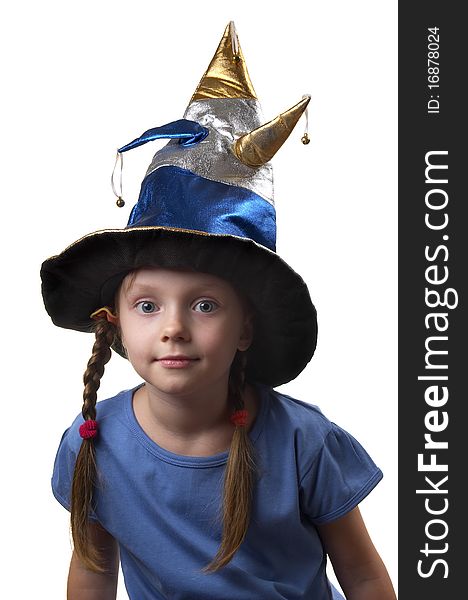 Little girl in the magic witch cap isolated over white background. Little girl in the magic witch cap isolated over white background