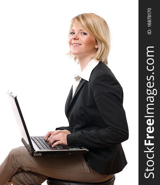 Young smiling businesswoman working with laptop