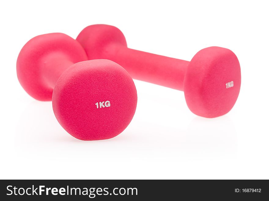 Two pink dumbbells isolated on white background