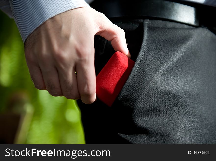 Man is whowing ring to the pocket just before wedding. Man is whowing ring to the pocket just before wedding