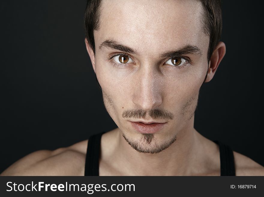 Young man's portrait. Close-up face.