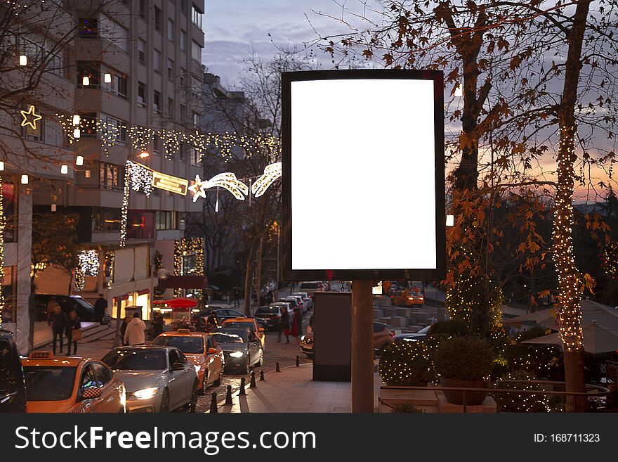 Blank billboard on night street