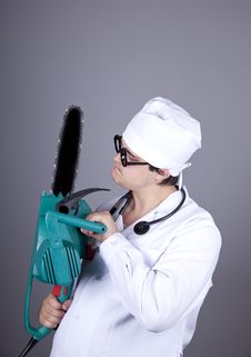 Crazy Doctor With Portable Saw. Stock Photography