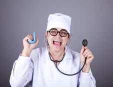 Crazy Doctor With A Stethoscope And Enema. Royalty Free Stock Photo