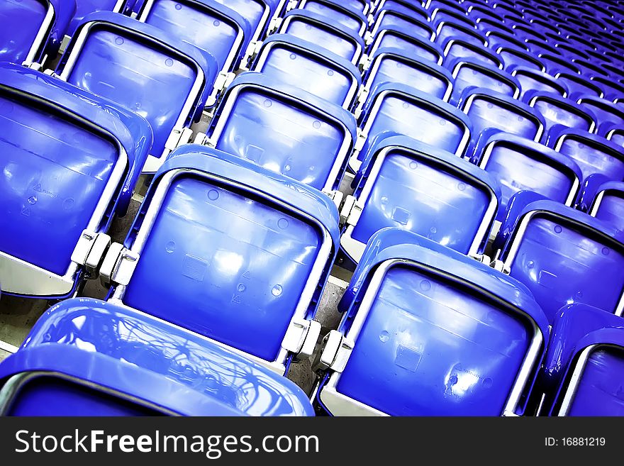 Empty blue seats at the stadium. Empty blue seats at the stadium