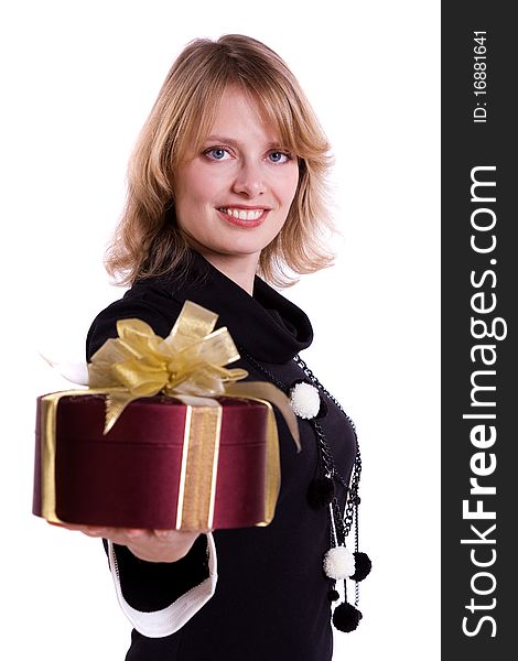 Beautiful smiling woman with a gift. Attractive girl holding purple box with gold ribbon. Isolated over white background. Beautiful smiling woman with a gift. Attractive girl holding purple box with gold ribbon. Isolated over white background