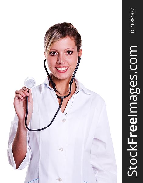 Close-up of a female doctor smiling with stethoscope. Woman Doctor At The Hospital. Close-up of a female doctor smiling with stethoscope. Woman Doctor At The Hospital