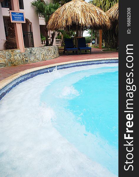 Luxury Resort Pool and hotel garden in Aruba.