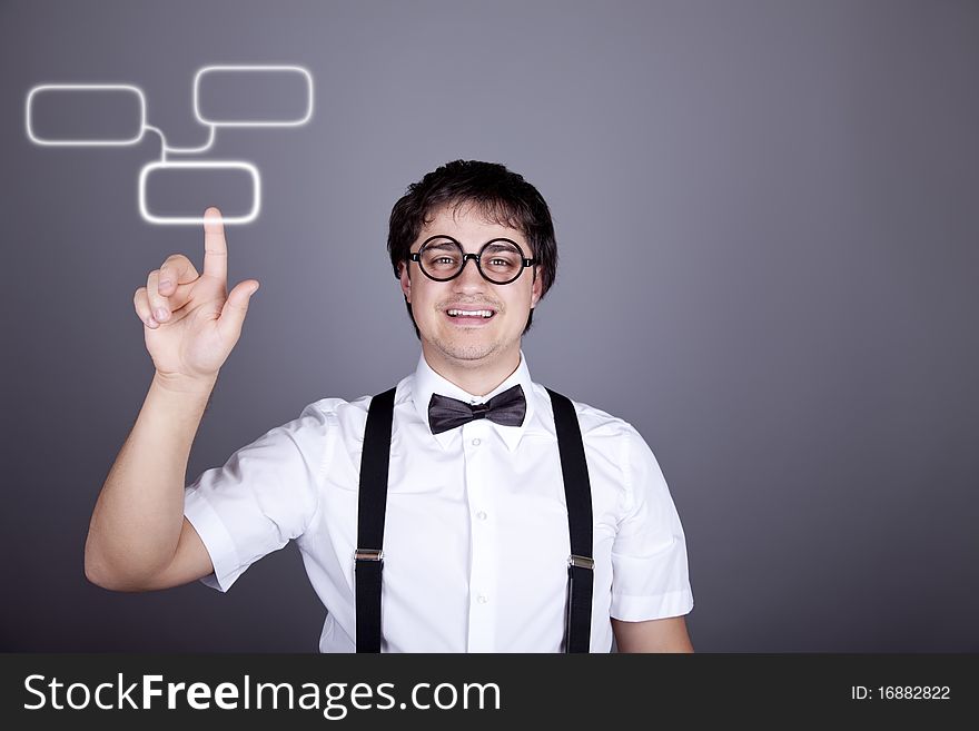 Portrait of funny fashion men in suspender with bow tie and glasses show visual plate. Studio shot. Portrait of funny fashion men in suspender with bow tie and glasses show visual plate. Studio shot.