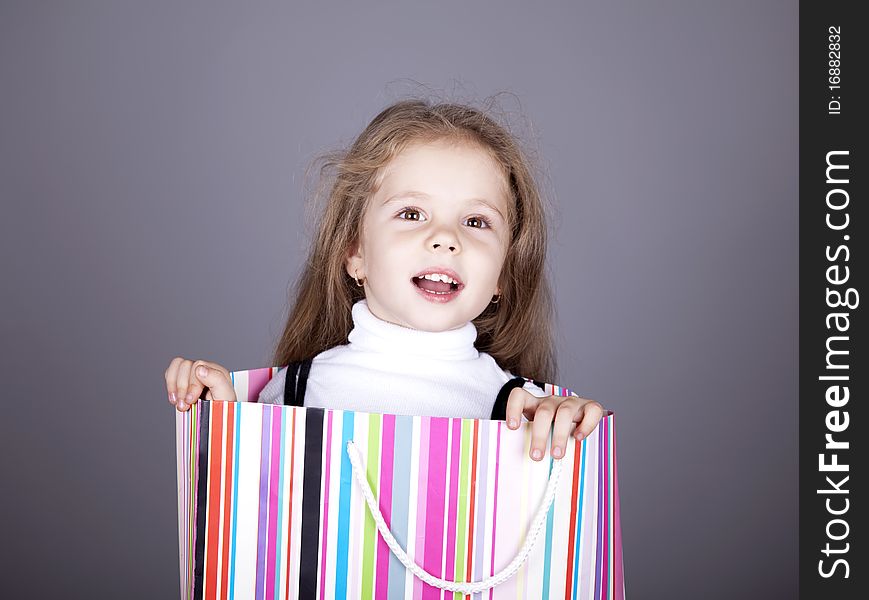 Little girl in shopping box.