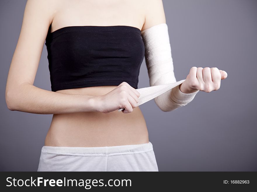 Strong girl's body with with elastic bandage