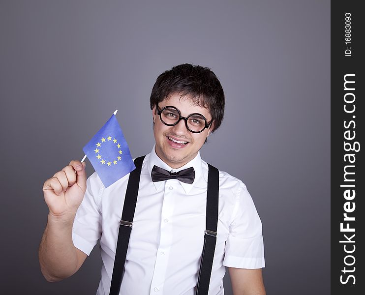 Funny men keeping European Union flag. Studio shot.