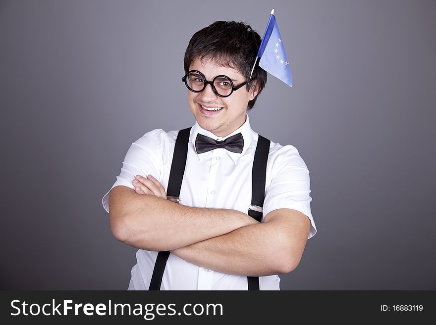 Funny men keeping European Union flag. Studio shot.