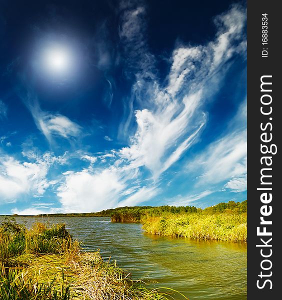 Beautiful Small Lake And Blue Sky By Autumn.