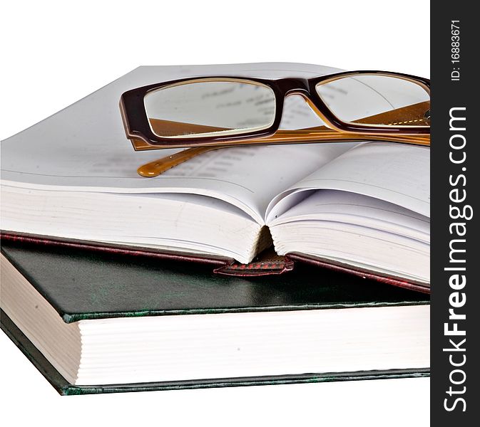 Close up of eyeglasses on open book