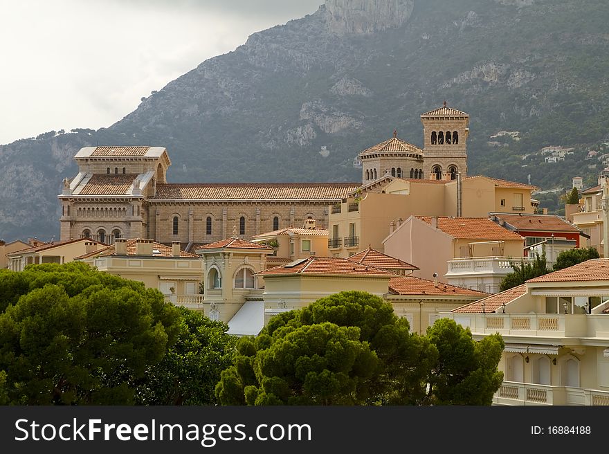 Monaco churcha nd palace rooftops seen from a nearby structure. Monte Carlo Europe. Monaco churcha nd palace rooftops seen from a nearby structure. Monte Carlo Europe.