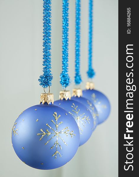 Glass spheres for an ornament hang on blue a background