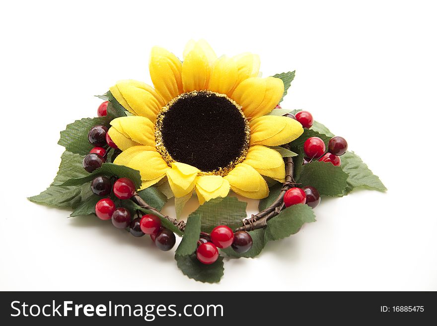 Sunflower in the wreath with berries