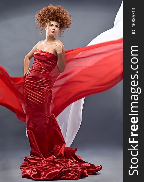 Beauty redheaded girl in fashion dress