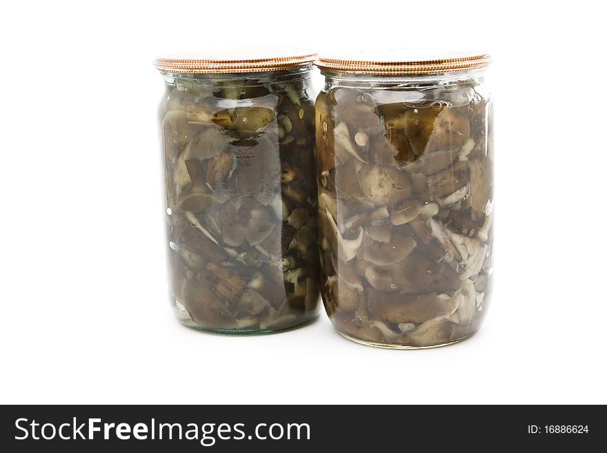 Two cans of canned mushrooms on a white background. Two cans of canned mushrooms on a white background.