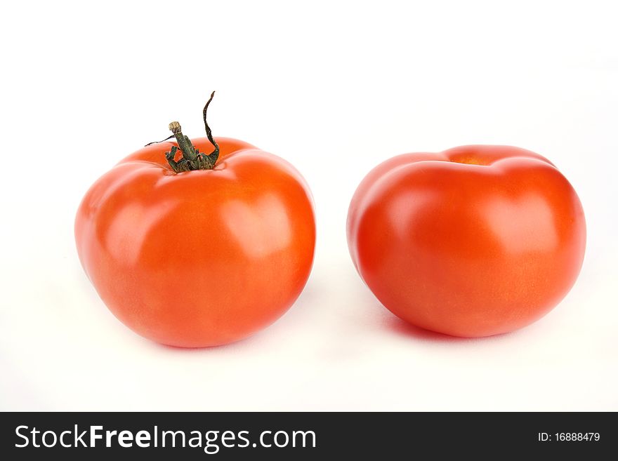 Close up two tomato isolated on white background