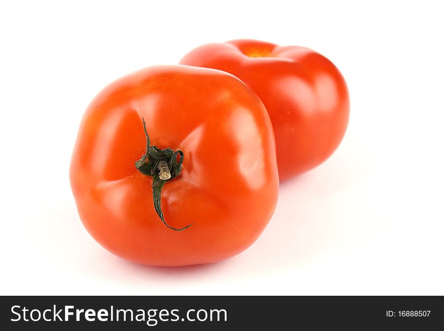 Close up two tomato isolated on white background