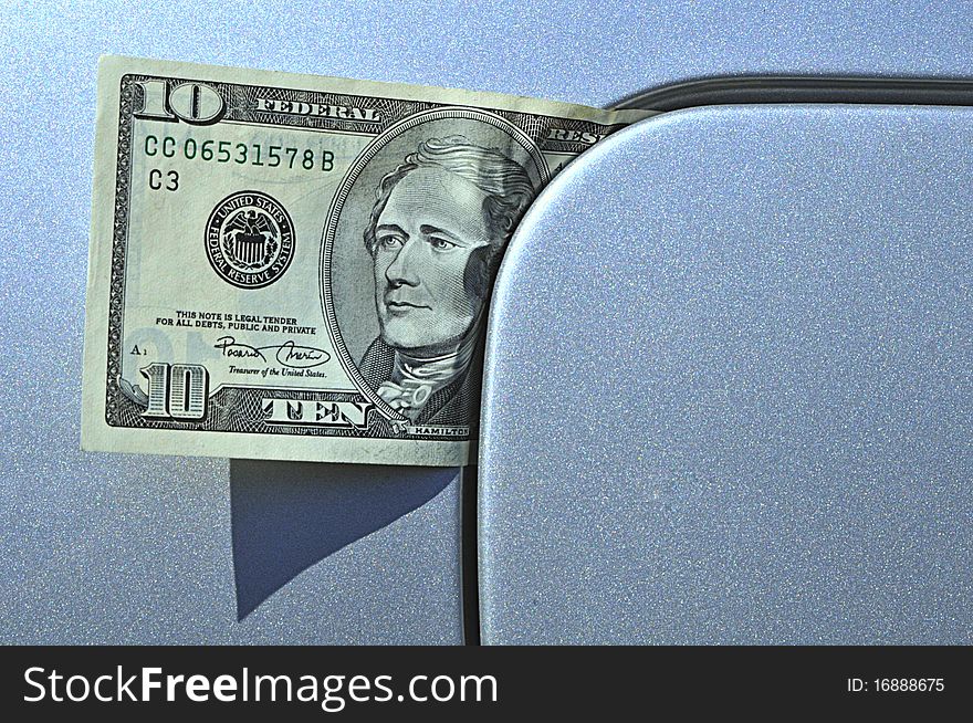 Ten dollar banknote under the lid of petrol tank of car. Ten dollar banknote under the lid of petrol tank of car.
