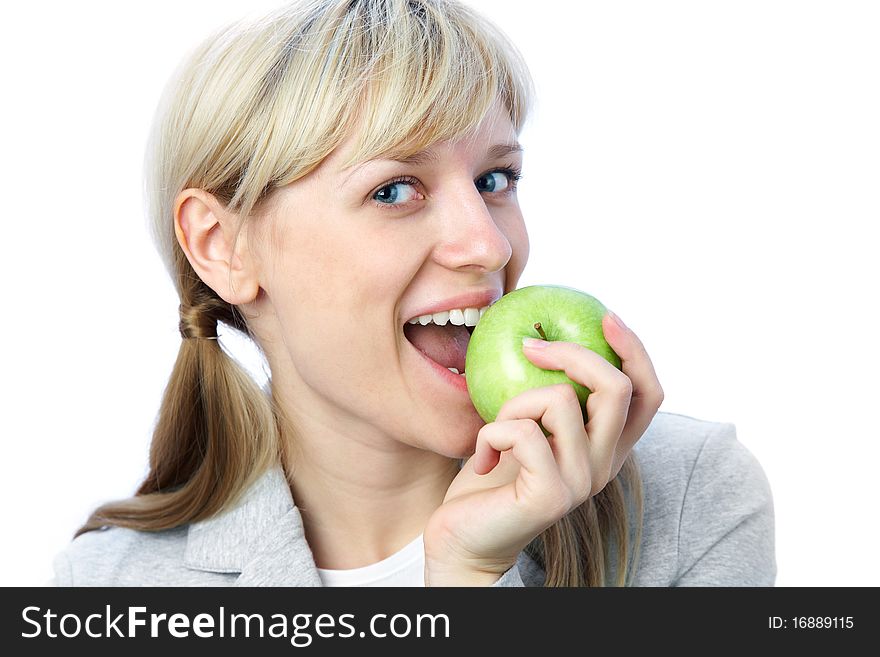 Portrait of smiling blonde girl with green apple on the white background. Portrait of smiling blonde girl with green apple on the white background
