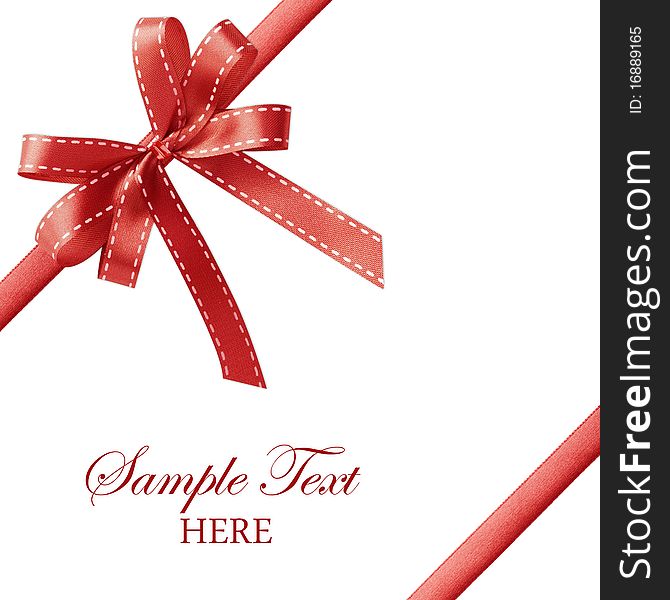 Shiny red satin ribbon on white background with copy space