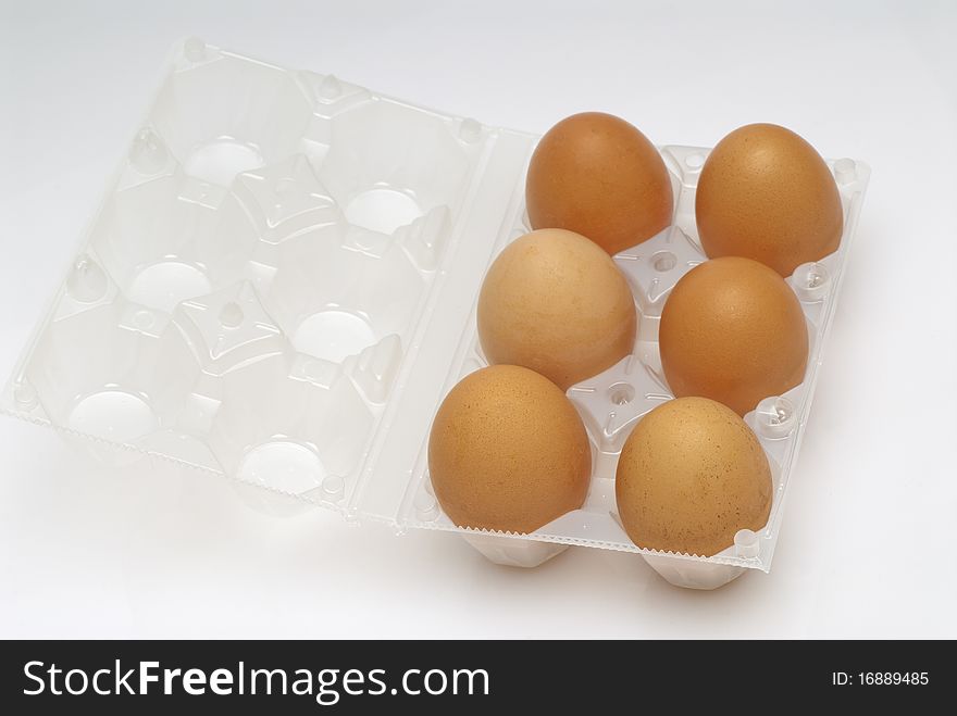 Six eggs in the plastic bag open