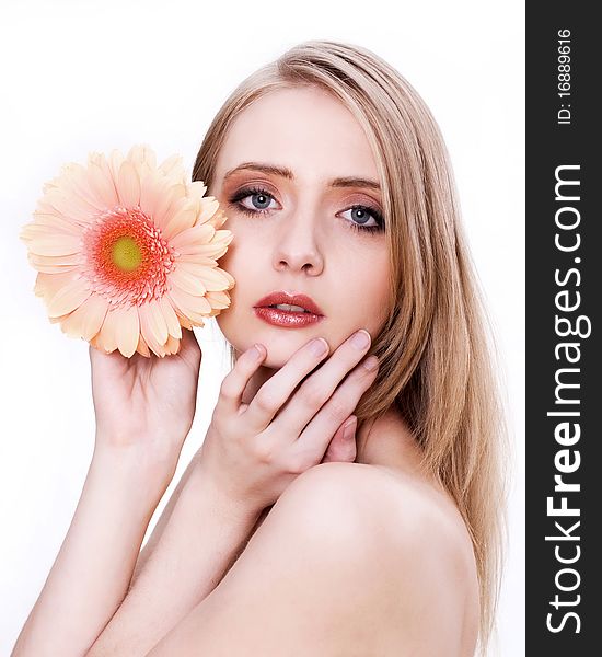 Skincare of young beautiful woman face with flower against white background