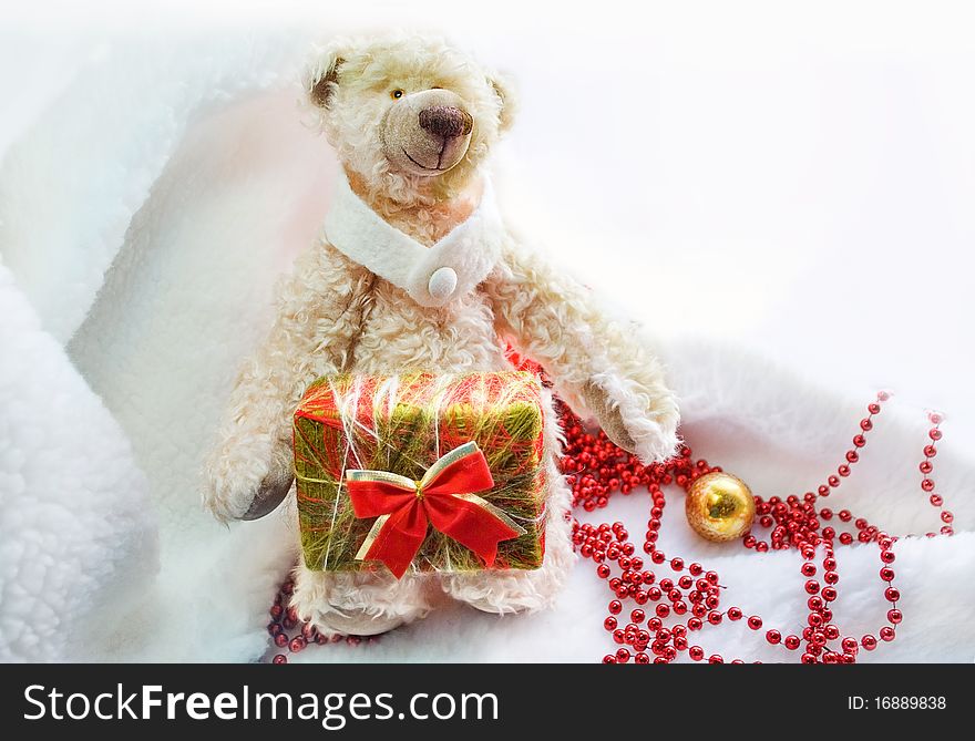 Bear with a christmas gift. Bear with a christmas gift