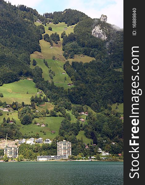 Alpine Lake with the hotel under the high mountain