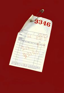 Red Pick-Up Ticket On Laundry Bag Royalty Free Stock Image Red Pick-Up Ticket On Laundry Bag Royalty Free Stock Image