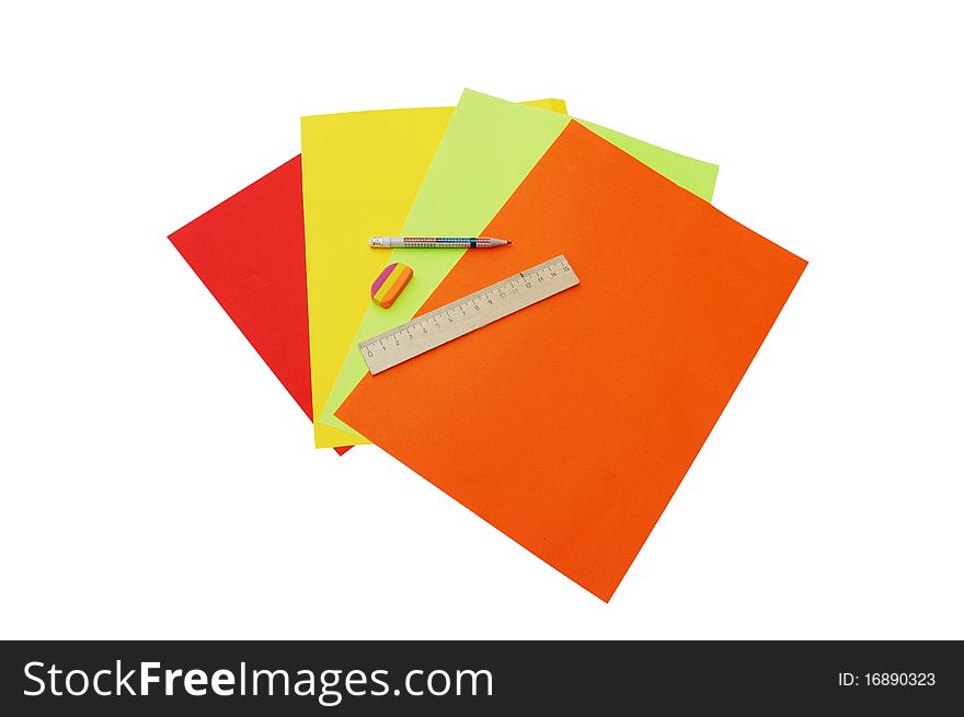 Four colourful papers, pencil, ruler and eraser isolated on white