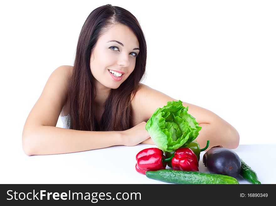 Young girl with vegetables over white background. Young girl with vegetables over white background