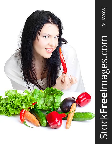 Beautiful woman with vegetables over white background. Beautiful woman with vegetables over white background