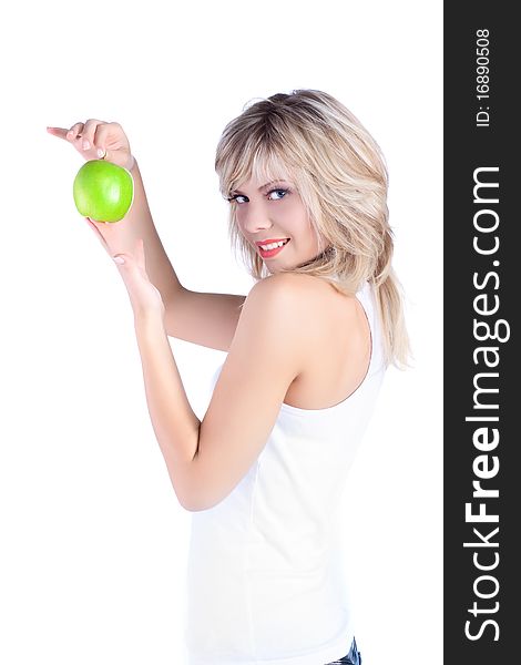 Young girl over white background with apple. Young girl over white background with apple