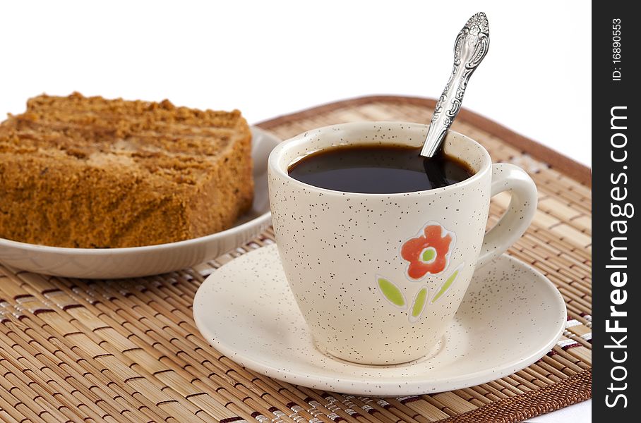 Cup of coffee with the honey cake. Cup of coffee with the honey cake.
