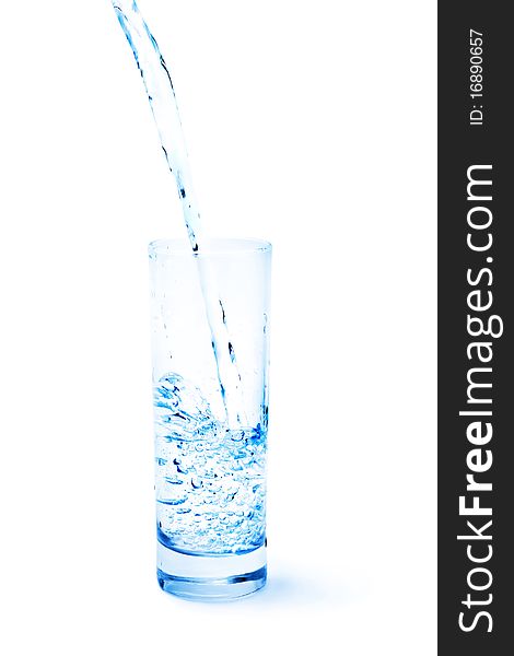 Clean water pouring into the glass isolated on white. Blue tonality. Clean water pouring into the glass isolated on white. Blue tonality.