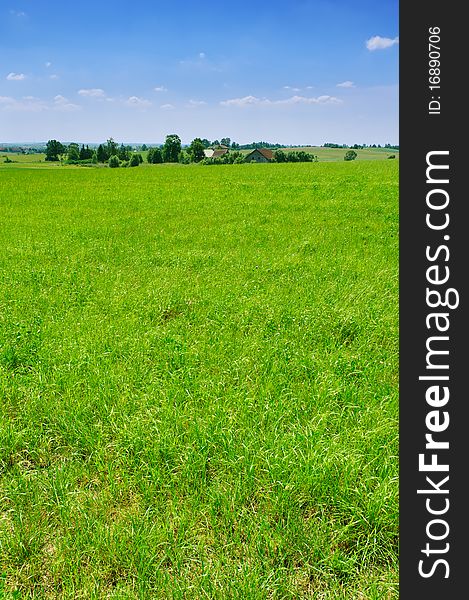 Summer green countryside landscape with small village, Poland, Europe. Summer green countryside landscape with small village, Poland, Europe