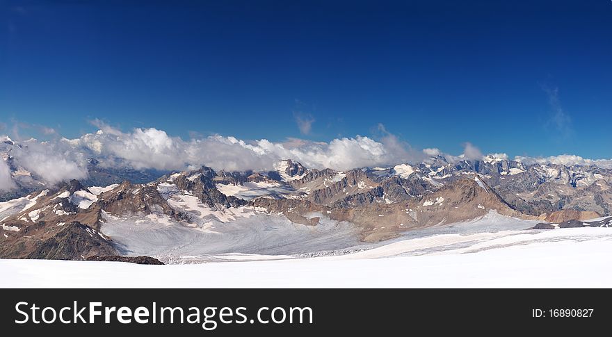 Mountain array with cloud and blue sky. Panorama