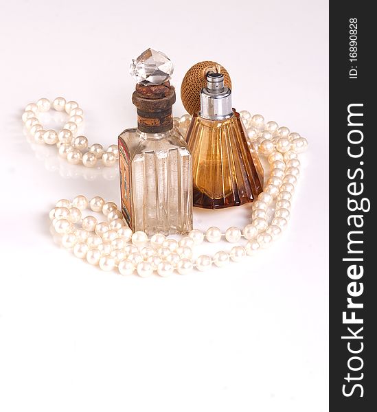 TWO PERFUME BOTTLES AND PEARLS