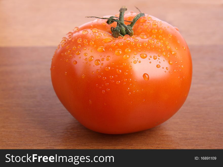 Close up tomato isolated on wood texture background