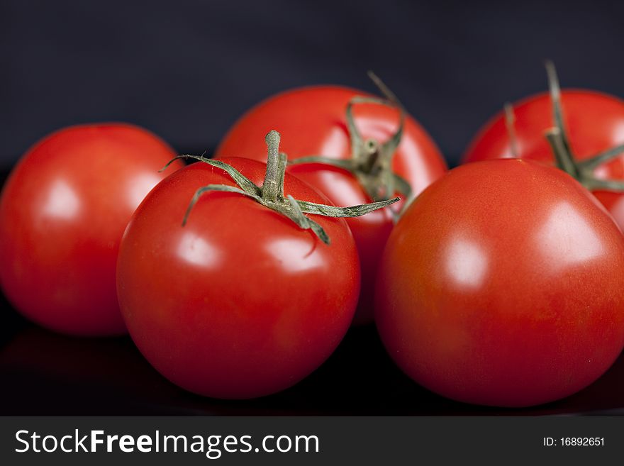Tomatoes On Black Background