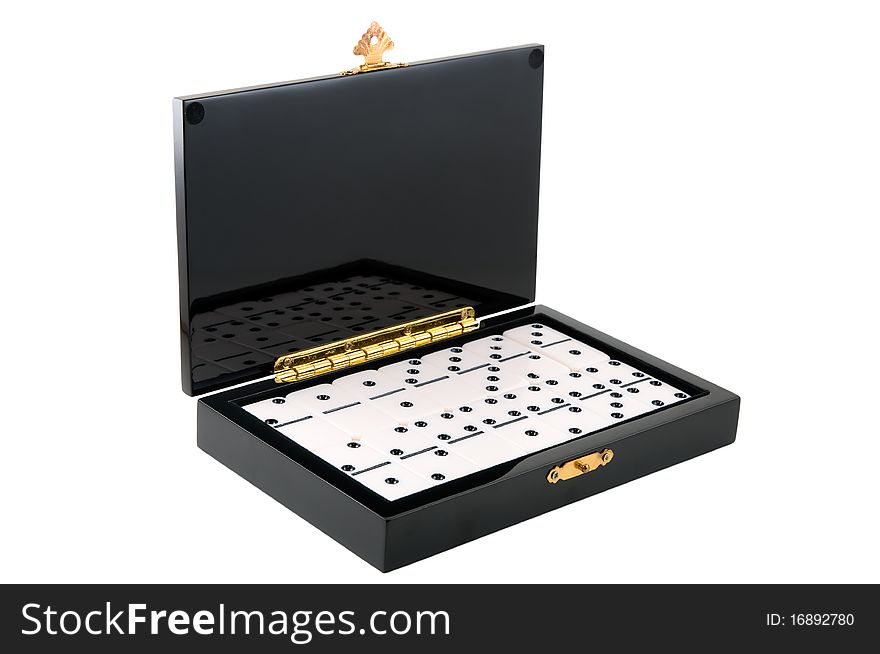 Casket with dominoes is photographed on the white background