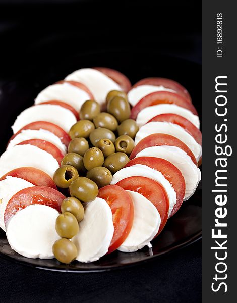 Mozzarella, tomatoes and olives - fresh and healthy food